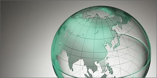 Image of stylized globe on grey background to represent the idea of Globalization.