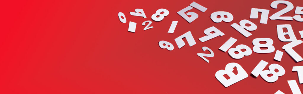 Image showing numbers and letters scattered on a red background. This represents data and ties in to the blog subject of Data Capture and Reporting.
