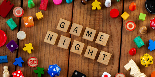 Image of game pieces and blocks spelling out 'Game Night'.