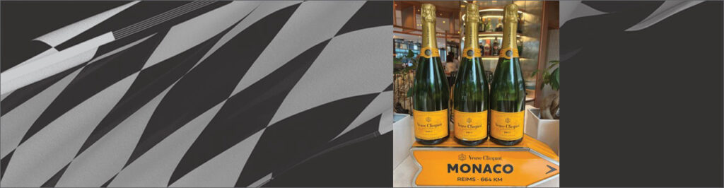 Image of champagne bottles in front of checkered background