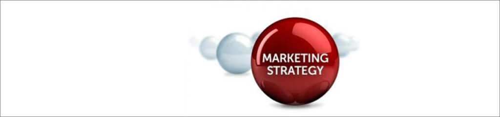 Image of balls lined up with the words 'Marketing Strategy' on centerd ball.