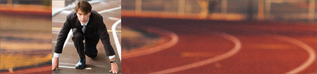 Image of business man crouched into the start position of a race.