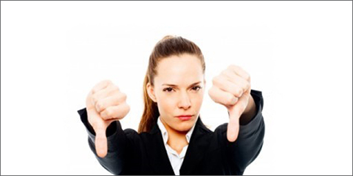 Image of business woman in 'thumbs down' gesture.